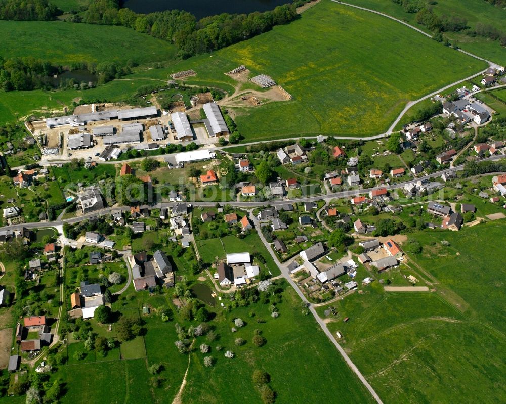 Chursdorf from the bird's eye view: Agricultural land and field boundaries surround the settlement area of the village in Chursdorf in the state Saxony, Germany