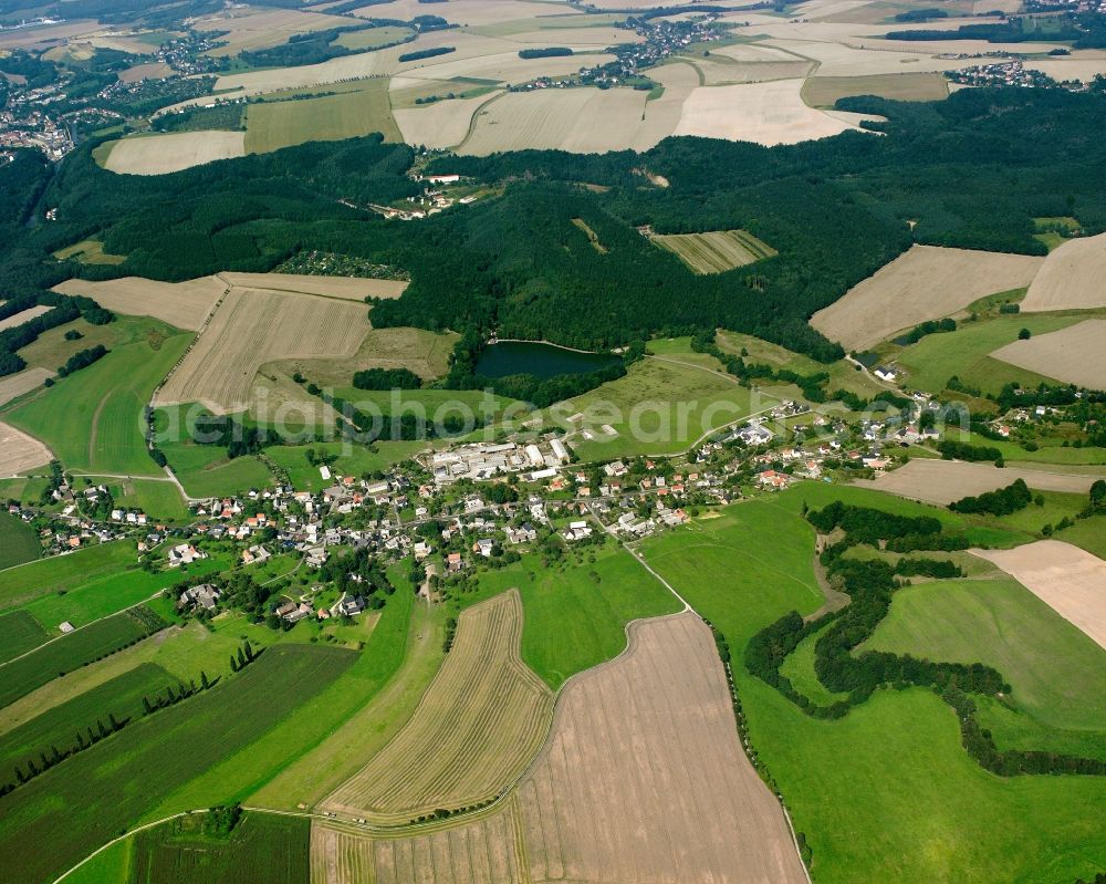 Chursdorf from the bird's eye view: Agricultural land and field boundaries surround the settlement area of the village in Chursdorf in the state Saxony, Germany