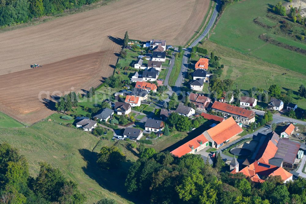 Clus from the bird's eye view: Agricultural land and field boundaries surround the settlement area of the village in Clus in the state Lower Saxony, Germany