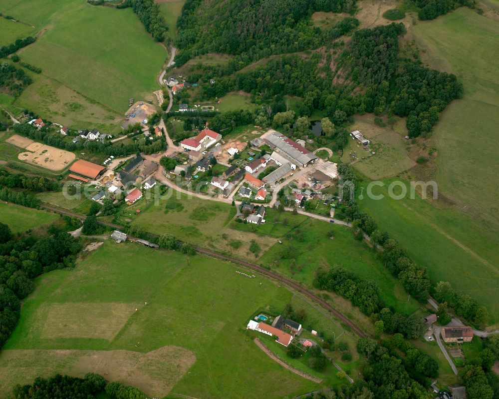 Collis from above - Agricultural land and field boundaries surround the settlement area of the village in Collis in the state Thuringia, Germany