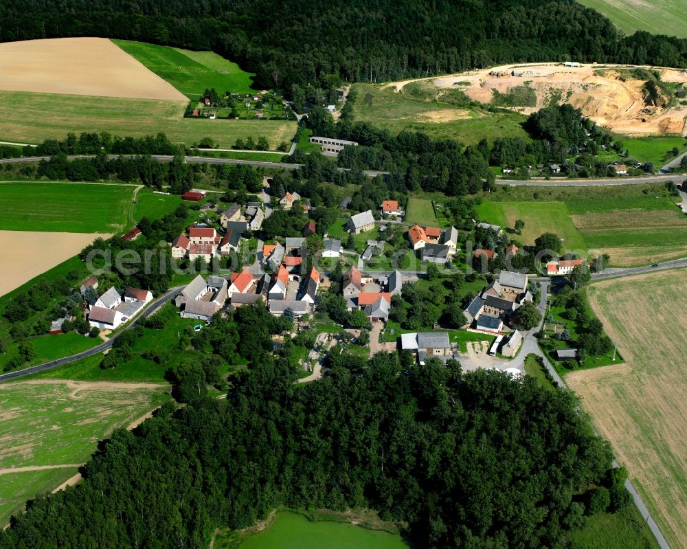 Aerial image Cossen - Agricultural land and field boundaries surround the settlement area of the village in Cossen in the state Saxony, Germany