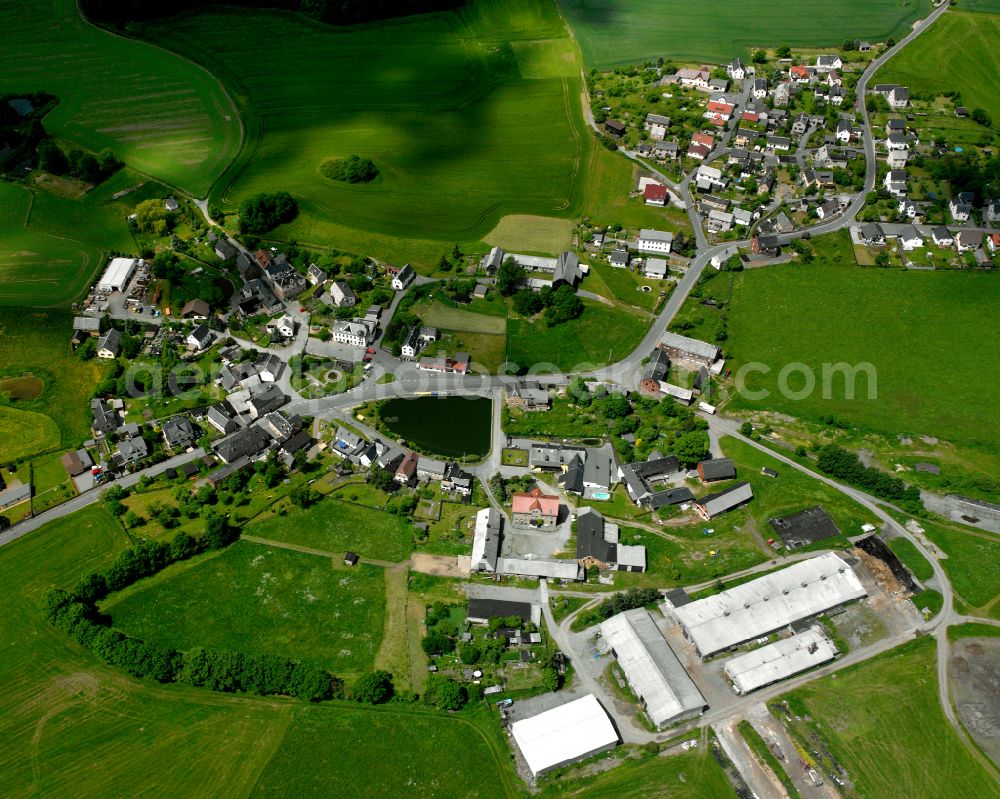 Aerial image Cossengrün - Agricultural land and field boundaries surround the settlement area of the village in Cossengrün in the state Thuringia, Germany