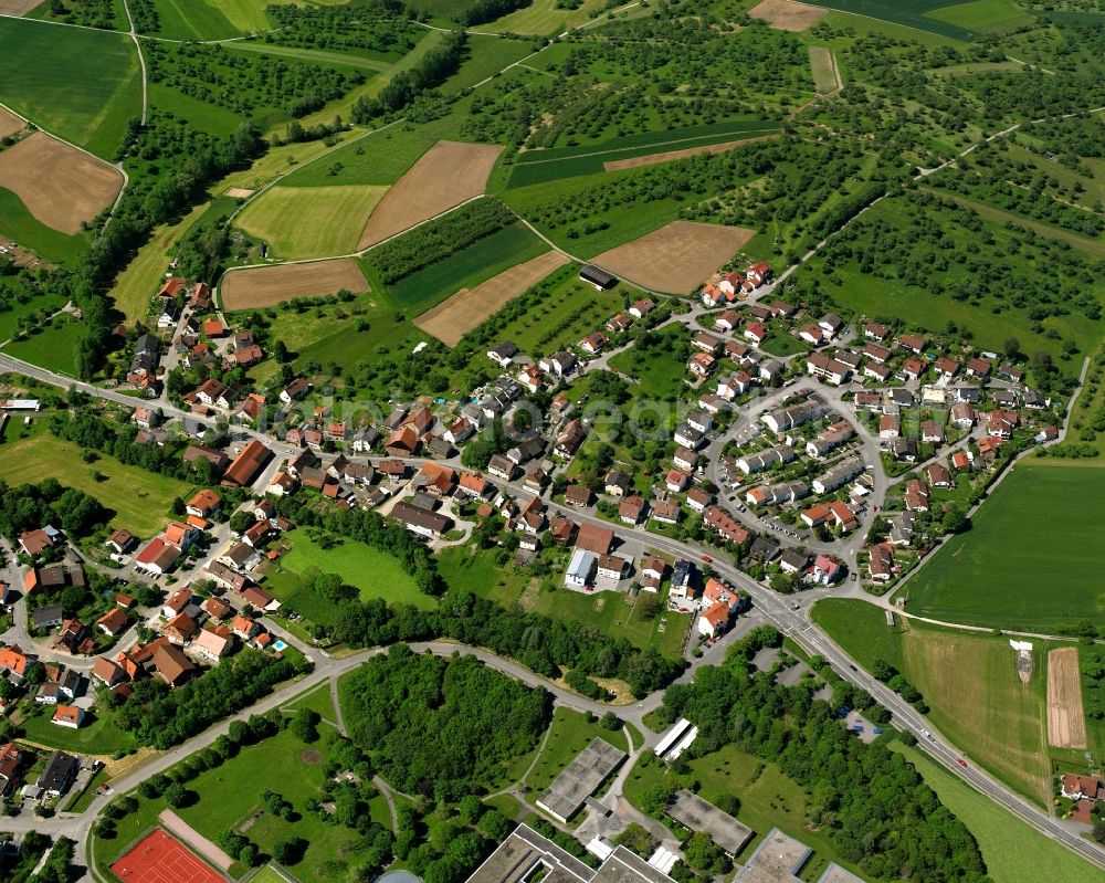 Aerial image Cottenweiler - Agricultural land and field boundaries surround the settlement area of the village in Cottenweiler in the state Baden-Wuerttemberg, Germany