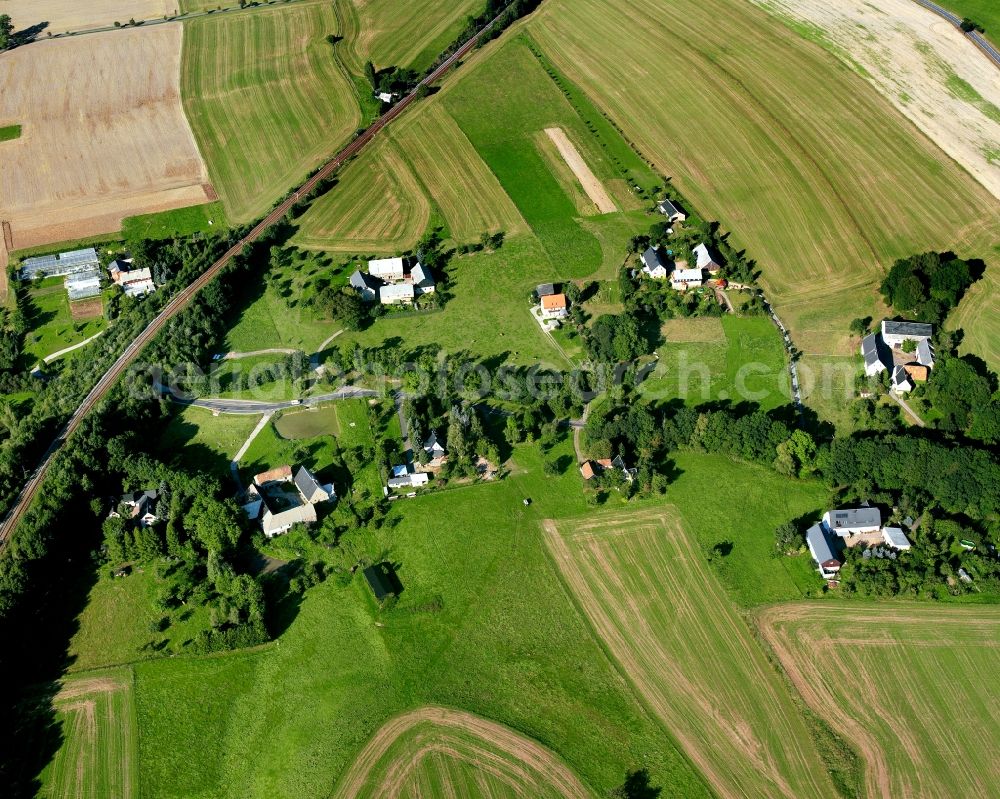 Aerial image Crossen - Agricultural land and field boundaries surround the settlement area of the village in Crossen in the state Saxony, Germany