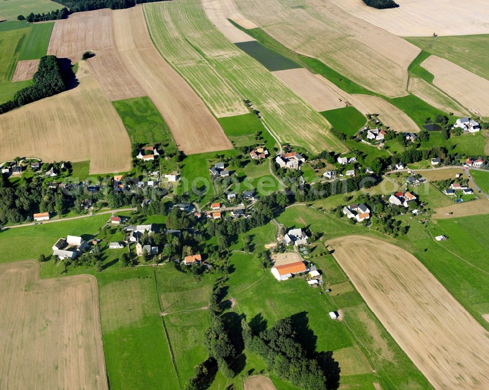 Crossen from above - Agricultural land and field boundaries surround the settlement area of the village in Crossen in the state Saxony, Germany