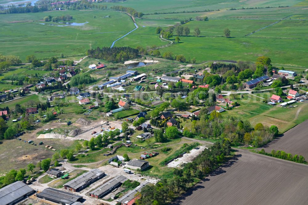 Damerow from above - Agricultural land and field boundaries surround the settlement area of the village in Damerow in the state Saxony-Anhalt, Germany