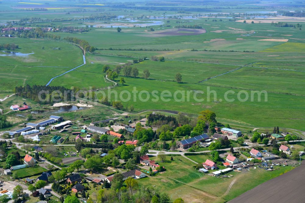 Damerow from the bird's eye view: Agricultural land and field boundaries surround the settlement area of the village in Damerow in the state Saxony-Anhalt, Germany