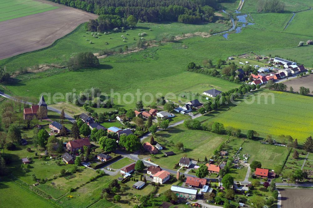 Aerial image Döbbersen - Agricultural land and field boundaries surround the settlement area of the village in Döbbersen in the state Mecklenburg - Western Pomerania, Germany