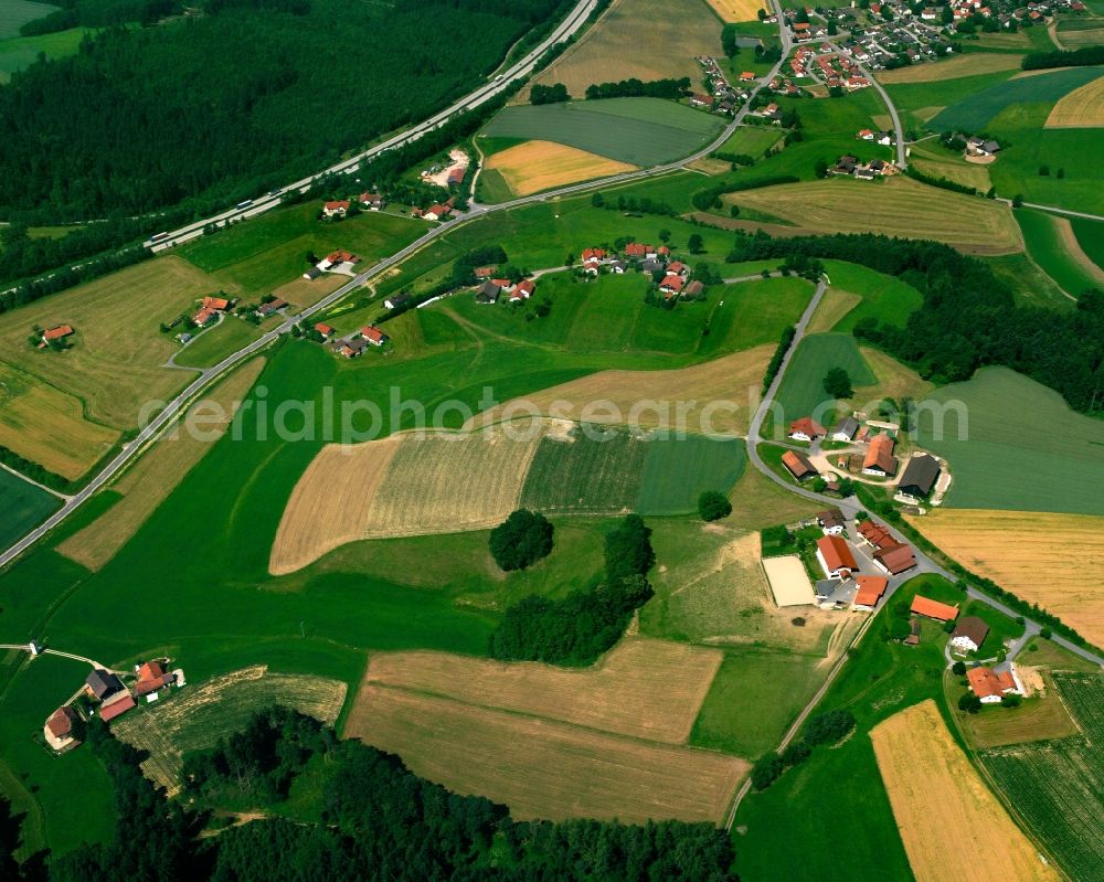 Aerial image Degernbach - Agricultural land and field boundaries surround the settlement area of the village in Degernbach in the state Bavaria, Germany