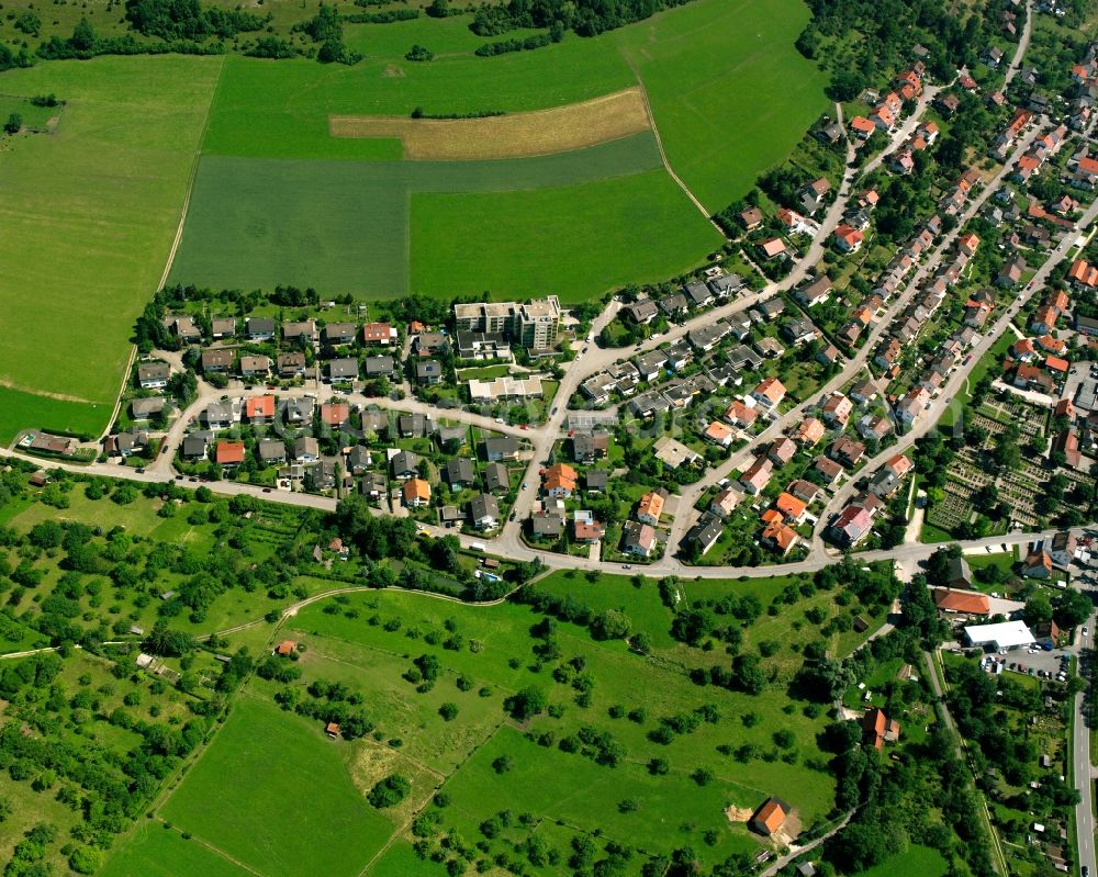 Deggingen from the bird's eye view: Agricultural land and field boundaries surround the settlement area of the village in Deggingen in the state Baden-Wuerttemberg, Germany