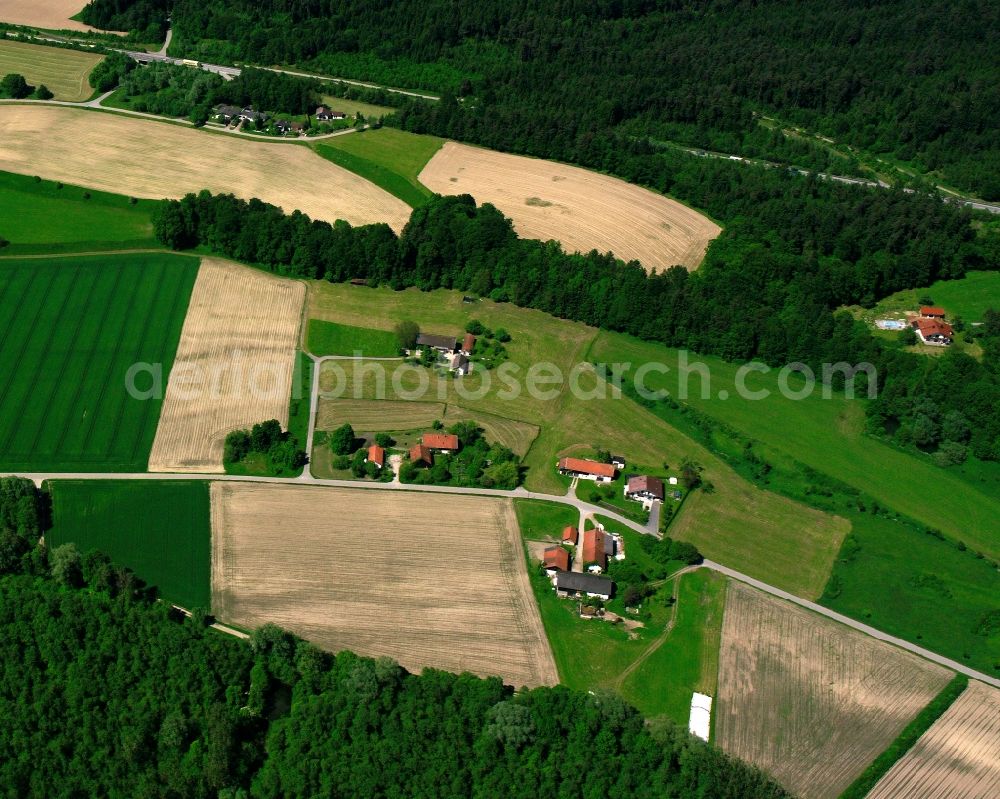 Deindorf from above - Agricultural land and field boundaries surround the settlement area of the village in Deindorf in the state Bavaria, Germany