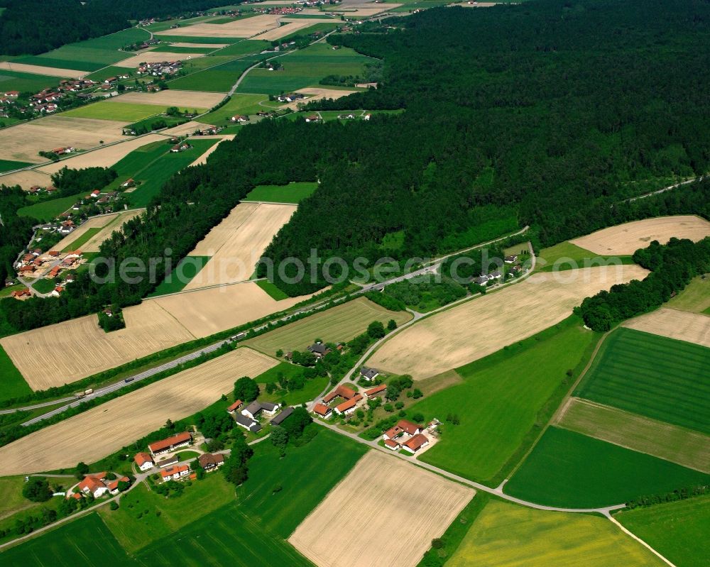 Deindorf from the bird's eye view: Agricultural land and field boundaries surround the settlement area of the village in Deindorf in the state Bavaria, Germany