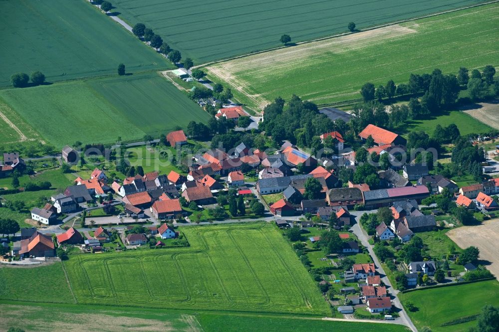 Deitersen from the bird's eye view: Agricultural land and field boundaries surround the settlement area of the village in Deitersen in the state Lower Saxony, Germany