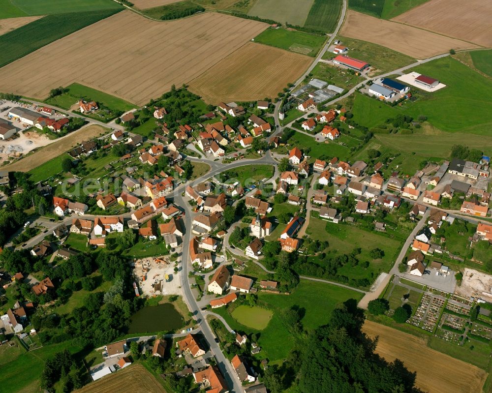 Dentlein am Forst from the bird's eye view: Agricultural land and field boundaries surround the settlement area of the village in Dentlein am Forst in the state Bavaria, Germany