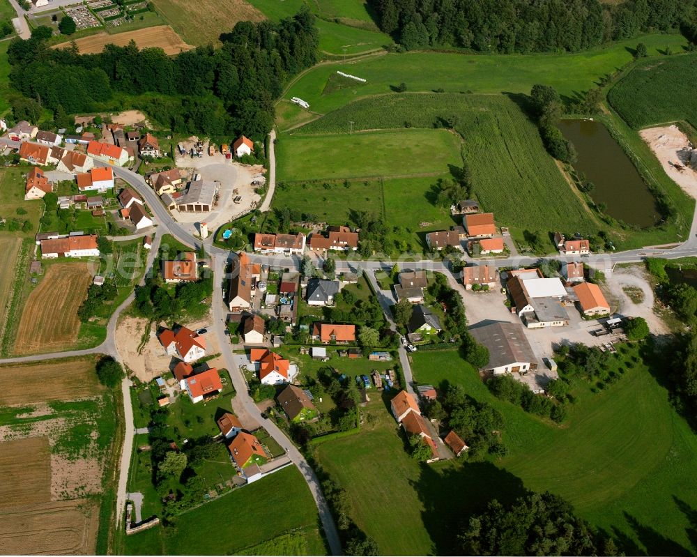 Aerial image Dentlein am Forst - Agricultural land and field boundaries surround the settlement area of the village in Dentlein am Forst in the state Bavaria, Germany