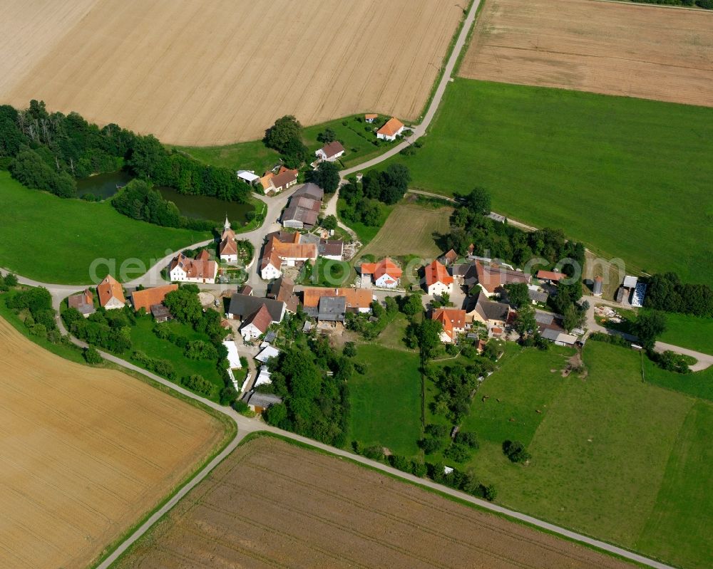 Dühren from the bird's eye view: Agricultural land and field boundaries surround the settlement area of the village in Dühren in the state Bavaria, Germany