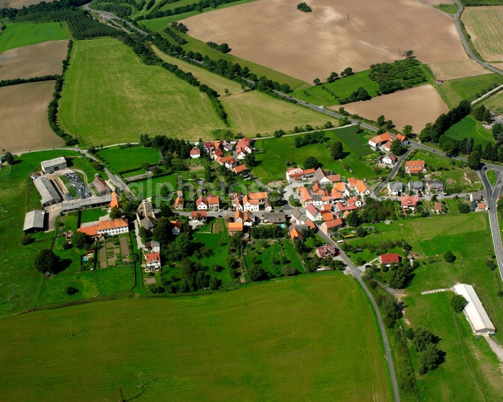 Diedorf from the bird's eye view: Agricultural land and field boundaries surround the settlement area of the village in Diedorf in the state Thuringia, Germany