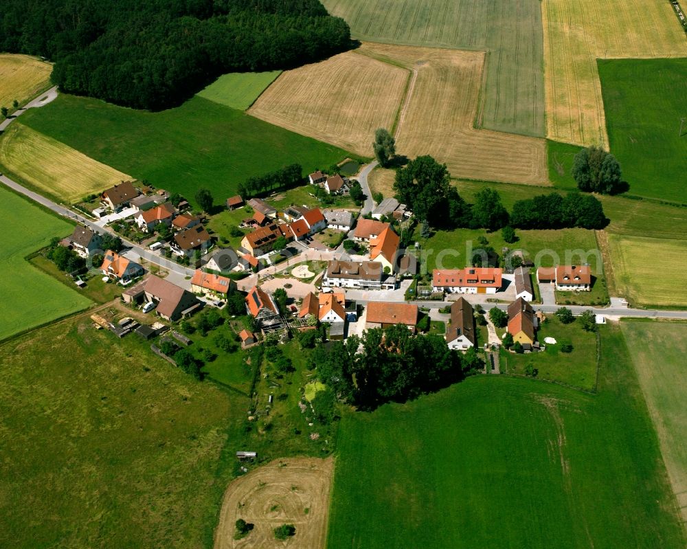 Dierersdorf from the bird's eye view: Agricultural land and field boundaries surround the settlement area of the village in Dierersdorf in the state Bavaria, Germany