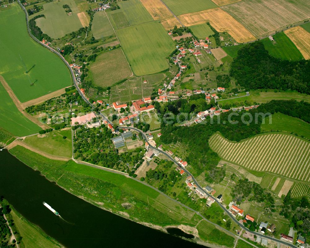 Aerial photograph Diesbar-Seußlitz - Agricultural land and field boundaries surround the settlement area of the village in Diesbar-Seußlitz in the state Saxony, Germany