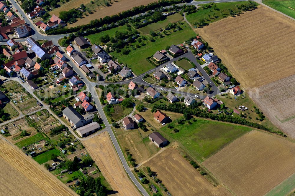 Aerial image Dipbach - Agricultural land and field boundaries surround the settlement area of the village in Dipbach in the state Bavaria, Germany