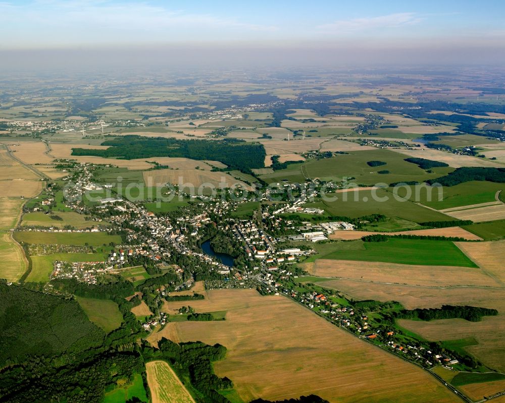 Dittmannsdorf from above - Agricultural land and field boundaries surround the settlement area of the village in Dittmannsdorf in the state Saxony, Germany