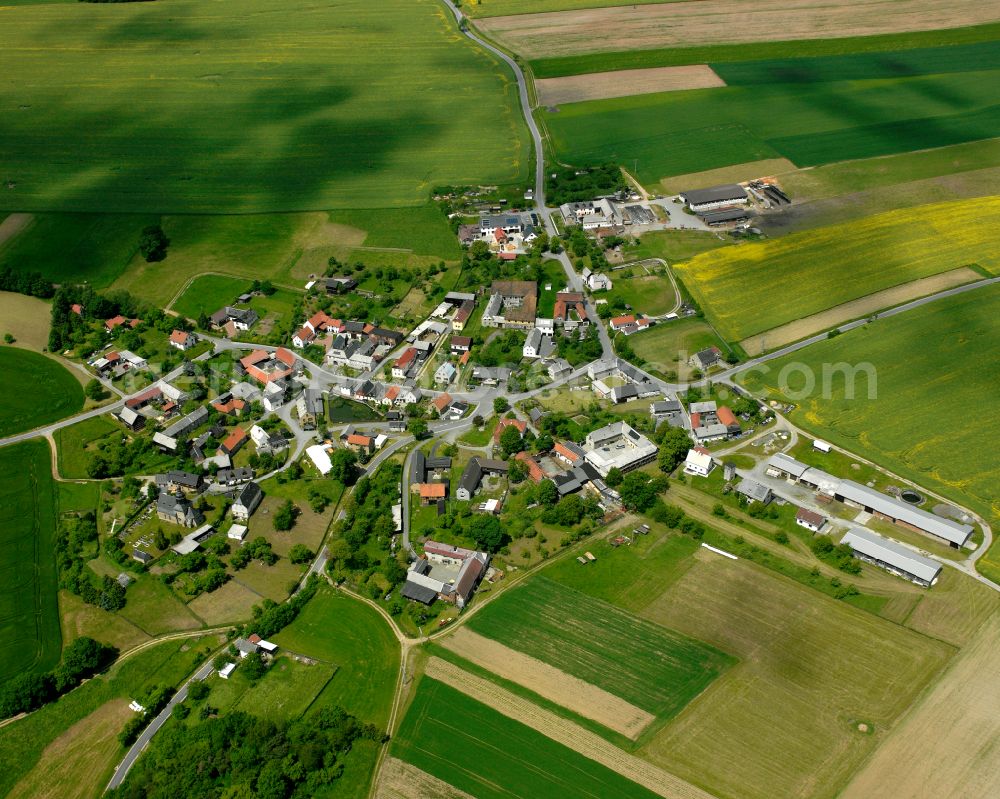 Dobia from above - Agricultural land and field boundaries surround the settlement area of the village in Dobia in the state Thuringia, Germany