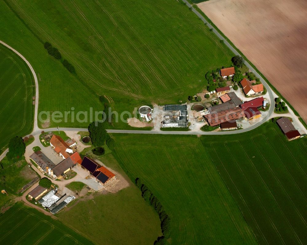 Aerial image Dornberg - Agricultural land and field boundaries surround the settlement area of the village in Dornberg in the state Bavaria, Germany