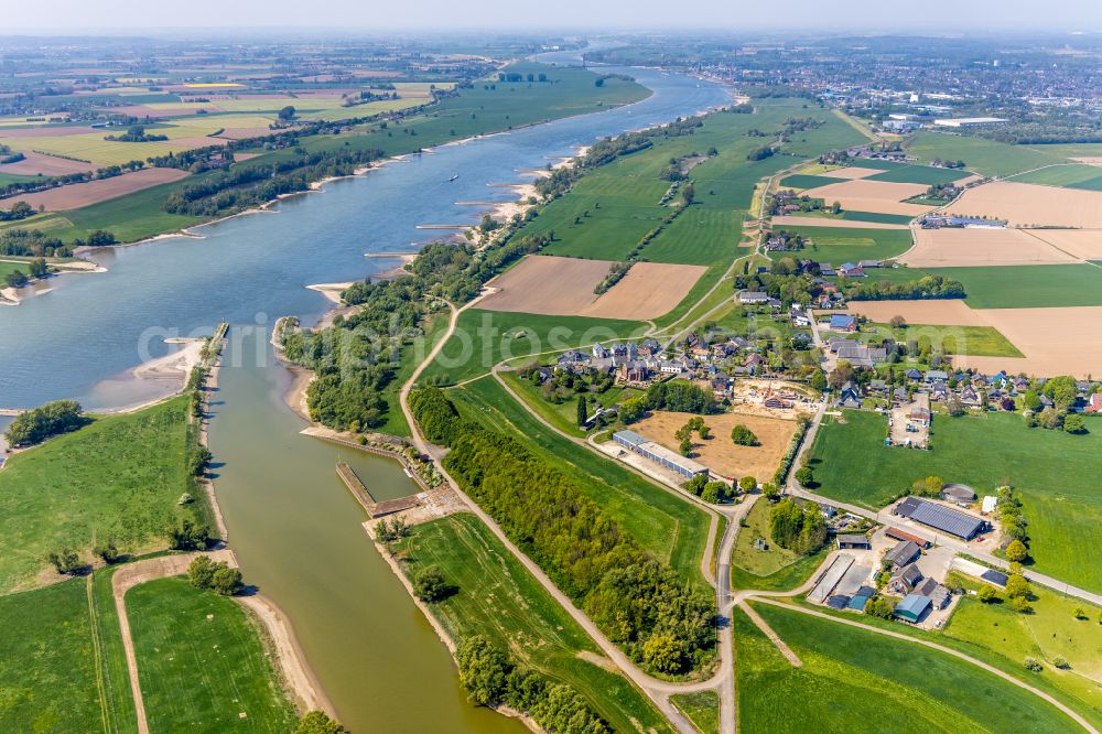 Aerial image Dornick - Agricultural land and field boundaries surround the settlement area of the village in Dornick in the state North Rhine-Westphalia, Germany