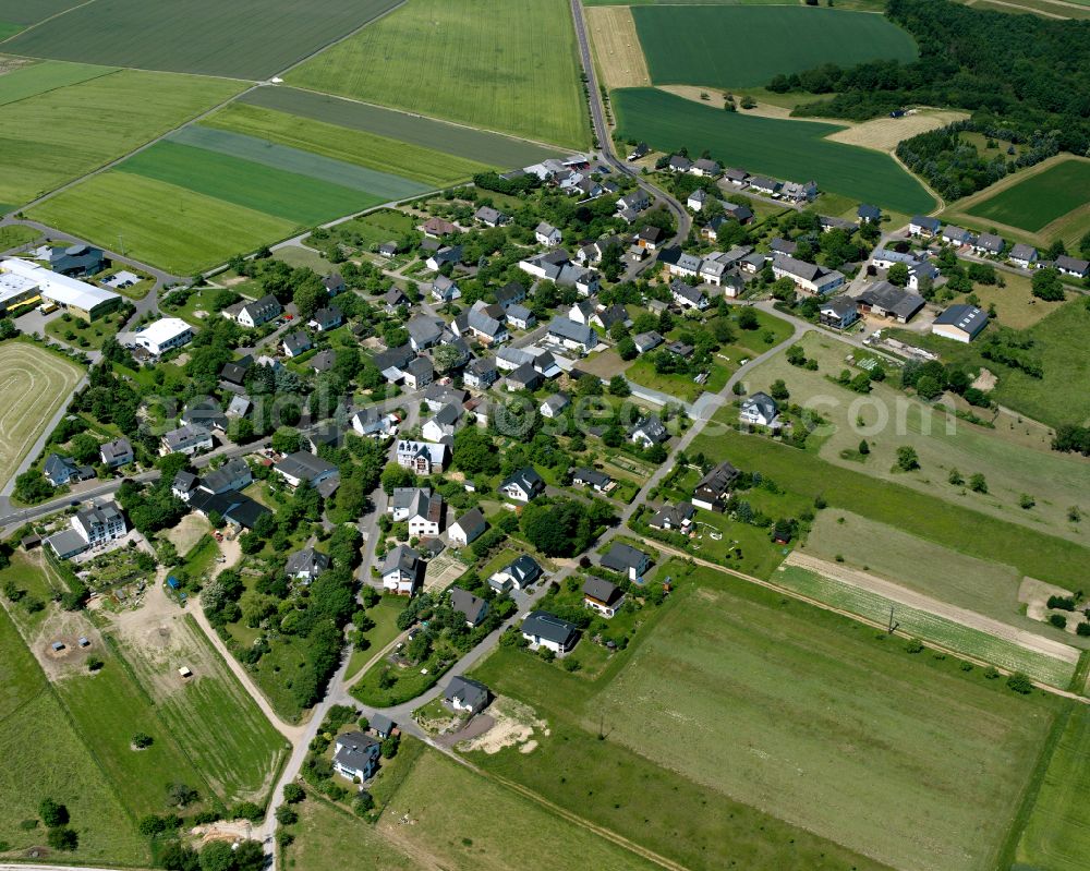 Aerial image Dorweiler - Agricultural land and field boundaries surround the settlement area of the village in Dorweiler in the state Rhineland-Palatinate, Germany