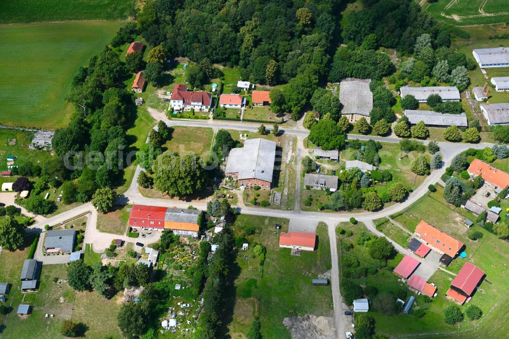 Dreetz from the bird's eye view: Agricultural land and field boundaries surround the settlement area of the village in Dreetz in the state Mecklenburg - Western Pomerania, Germany