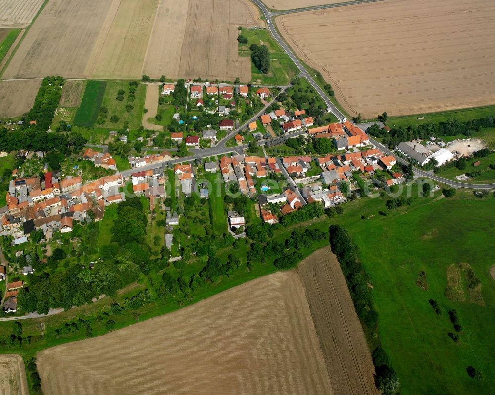 Dörna from above - Agricultural land and field boundaries surround the settlement area of the village in Dörna in the state Thuringia, Germany