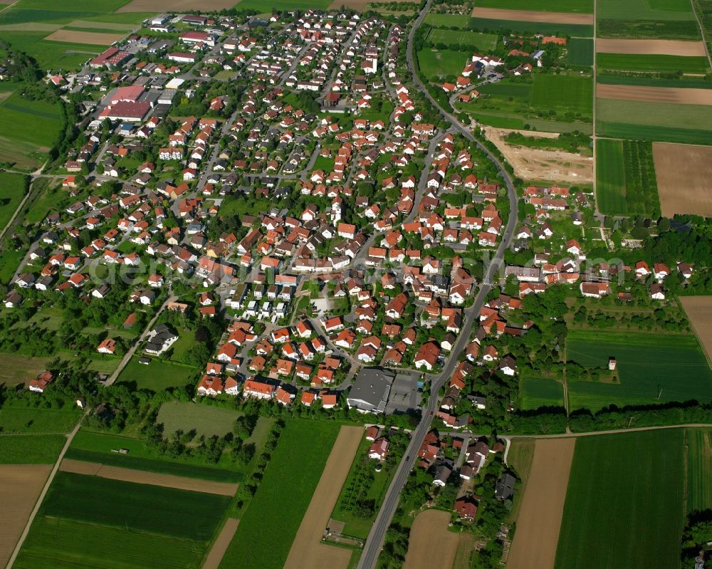 Dürnau from above - Agricultural land and field boundaries surround the settlement area of the village in Dürnau in the state Baden-Wuerttemberg, Germany