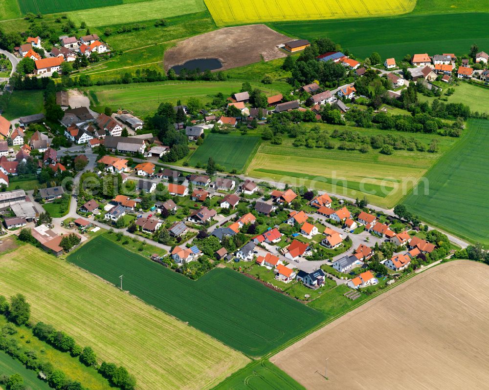 Dürnau from above - Agricultural land and field boundaries surround the settlement area of the village in Dürnau in the state Baden-Wuerttemberg, Germany