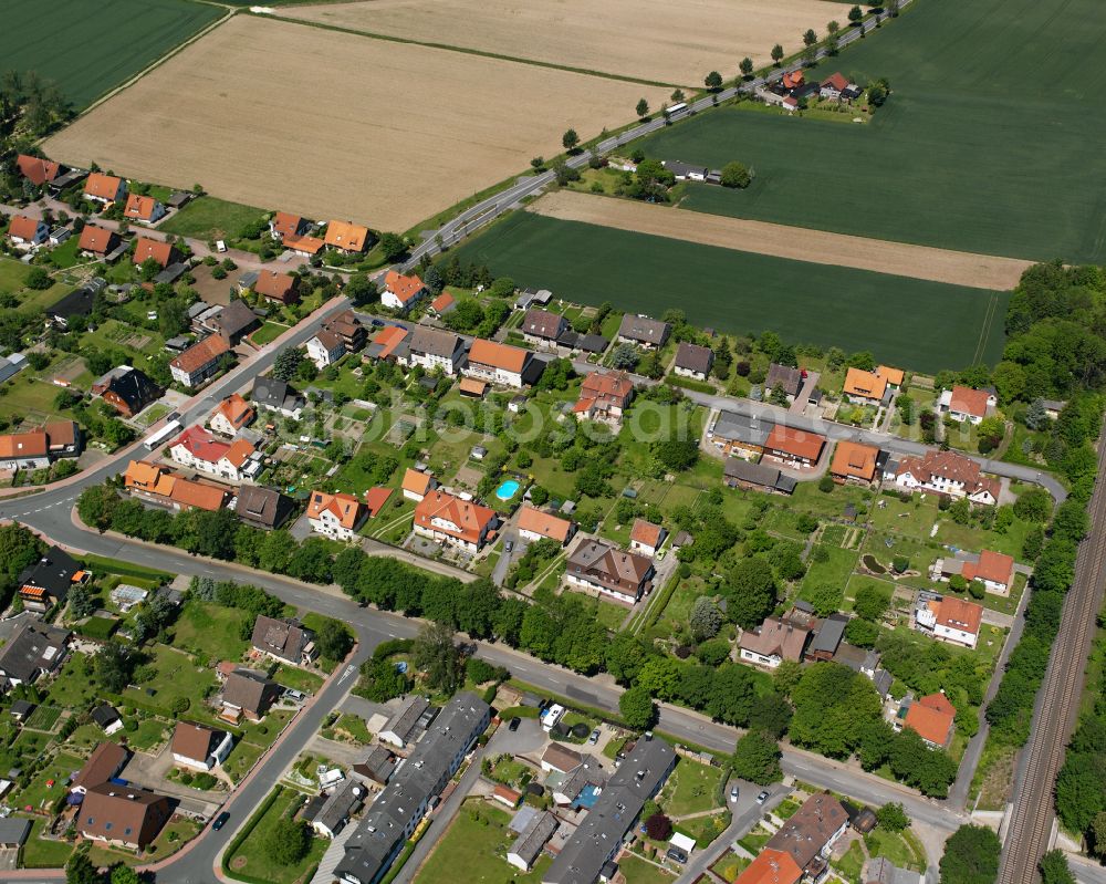 Dörnten from above - Agricultural land and field boundaries surround the settlement area of the village in Dörnten in the state Lower Saxony, Germany