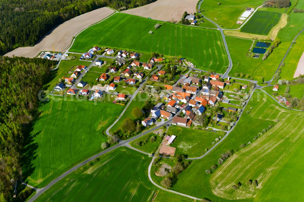 Aerial image Dürrnbuch - Agricultural land and field boundaries surround the settlement area of the village in Dürrnbuch in the state Bavaria, Germany