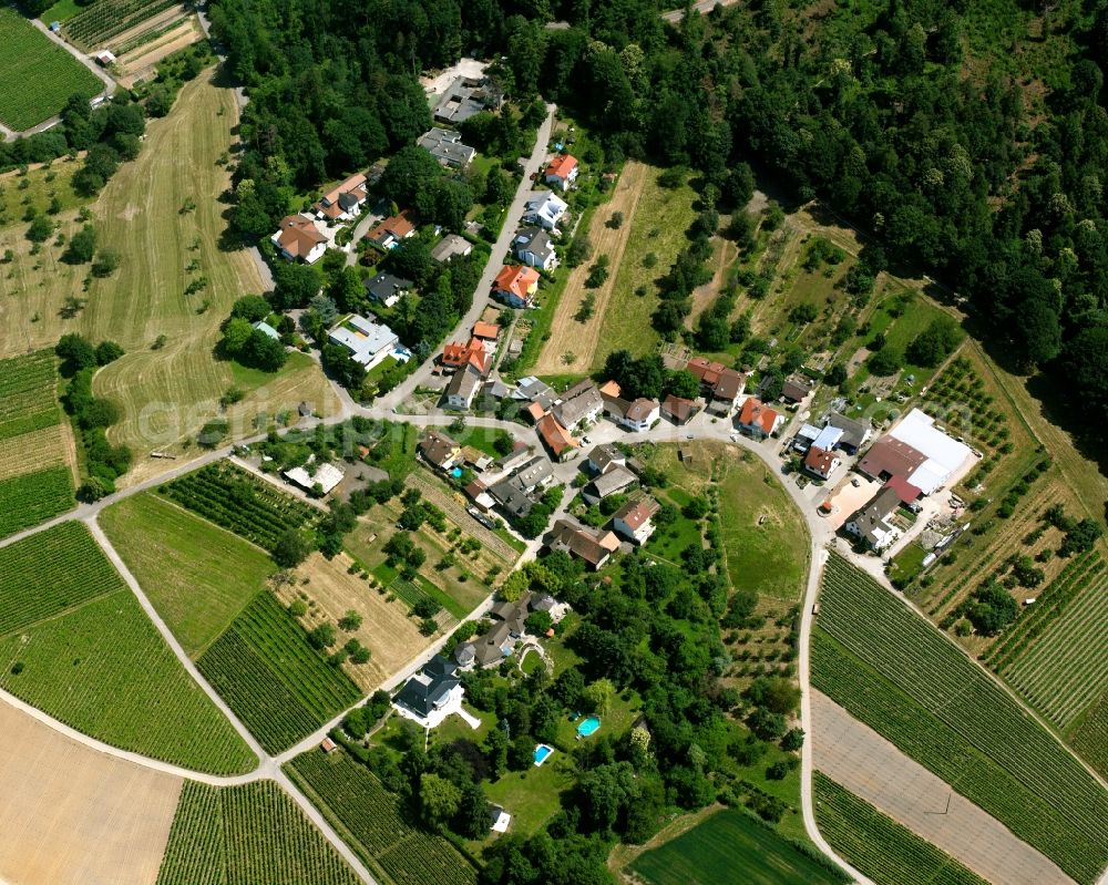 Ebenung from above - Agricultural land and field boundaries surround the settlement area of the village in Ebenung in the state Baden-Wuerttemberg, Germany