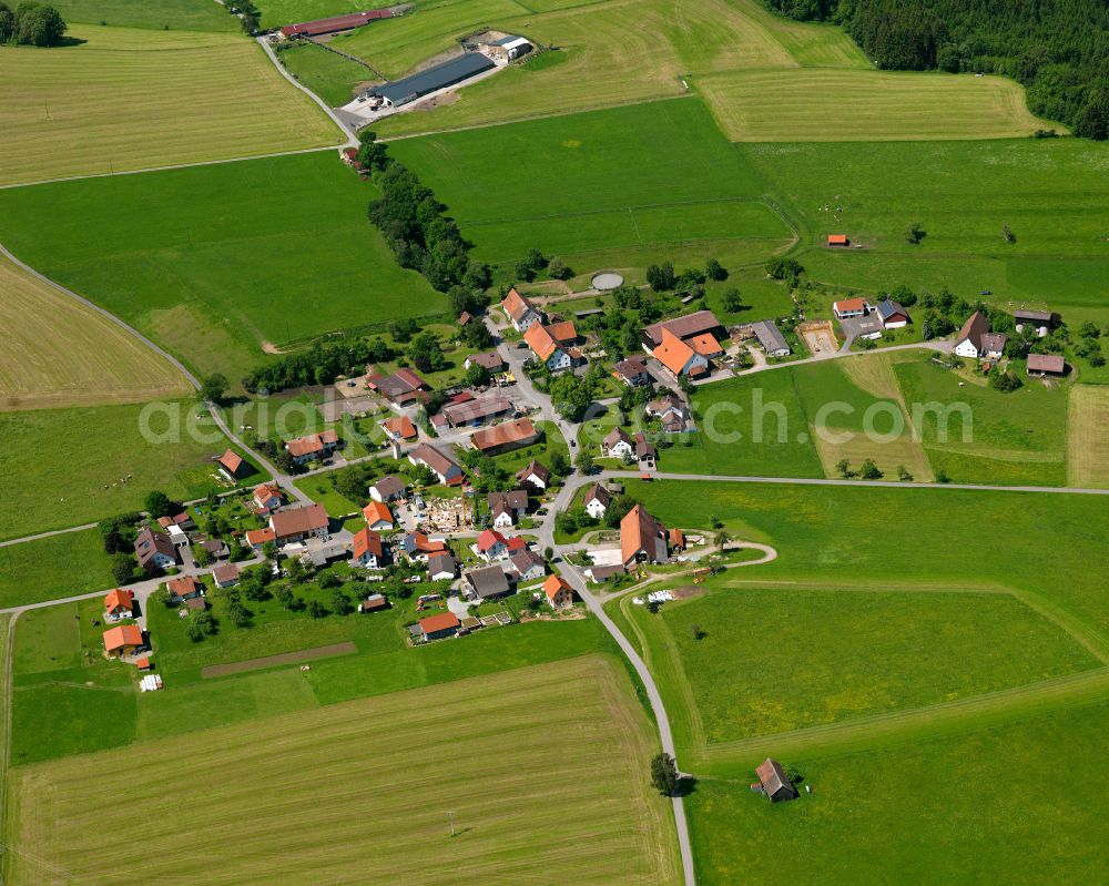 Eberhardzell from the bird's eye view: Agricultural land and field boundaries surround the settlement area of the village in Eberhardzell in the state Baden-Wuerttemberg, Germany