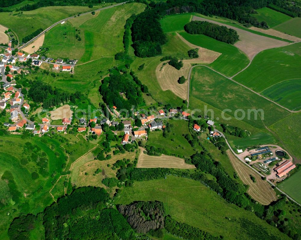 Eckersweiler from the bird's eye view: Agricultural land and field boundaries surround the settlement area of the village in Eckersweiler in the state Rhineland-Palatinate, Germany