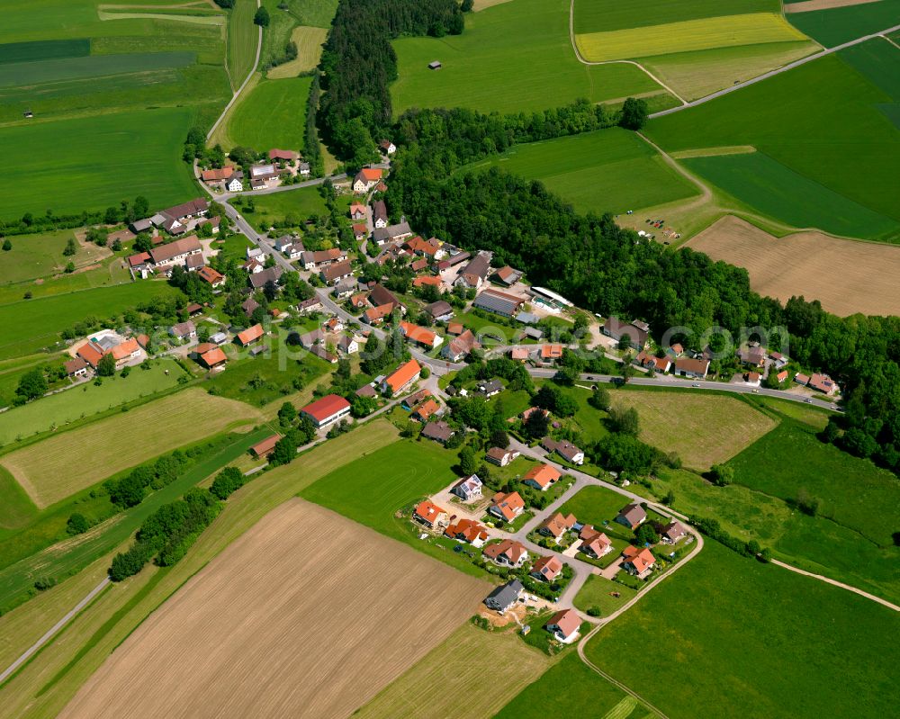 Edenbachen from the bird's eye view: Agricultural land and field boundaries surround the settlement area of the village in Edenbachen in the state Baden-Wuerttemberg, Germany