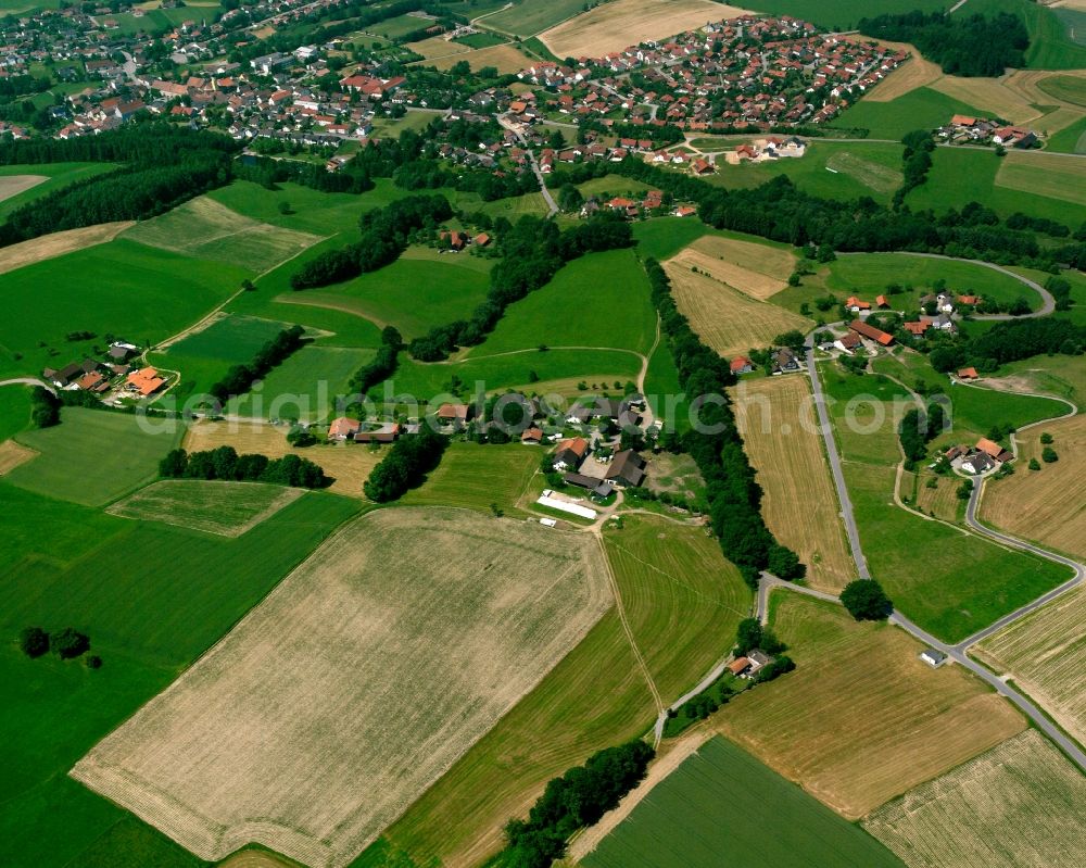 Edersdorf from above - Agricultural land and field boundaries surround the settlement area of the village in Edersdorf in the state Bavaria, Germany