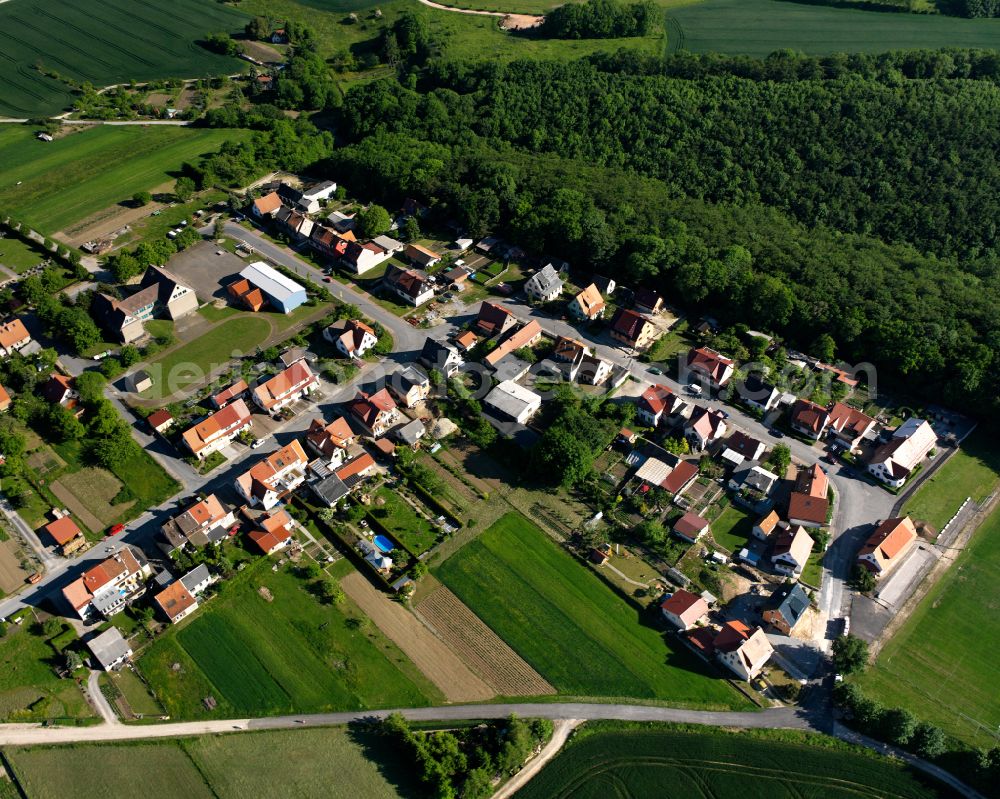 Effelder from above - Agricultural land and field boundaries surround the settlement area of the village in Effelder in the state Thuringia, Germany