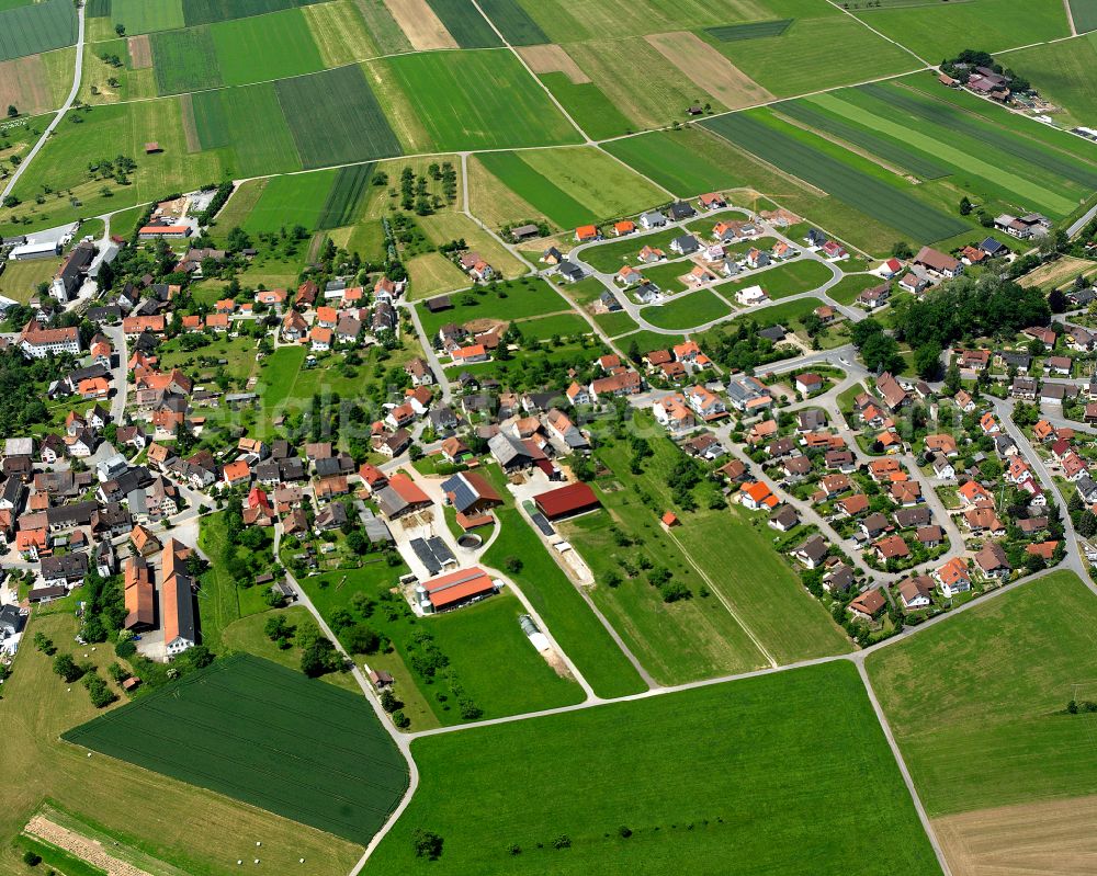 Egenhausen from the bird's eye view: Agricultural land and field boundaries surround the settlement area of the village in Egenhausen in the state Baden-Wuerttemberg, Germany