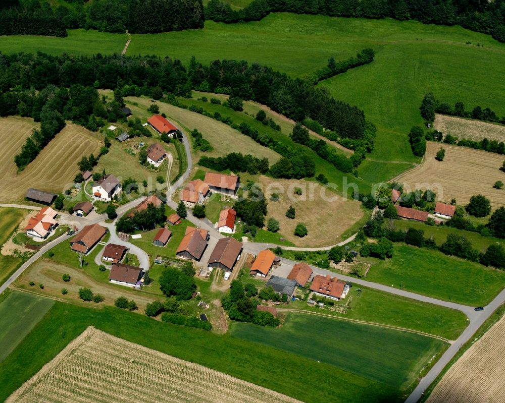 Eggersberg from the bird's eye view: Agricultural land and field boundaries surround the settlement area of the village in Eggersberg in the state Bavaria, Germany