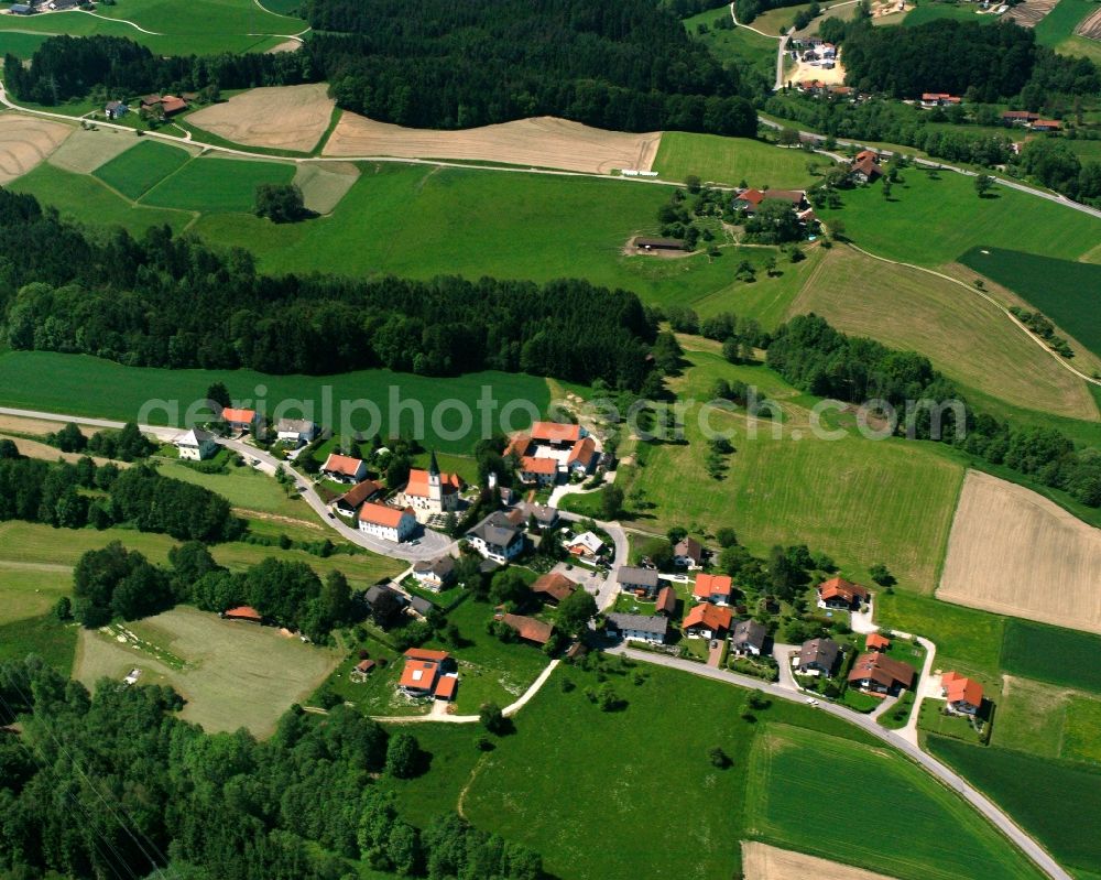 Eggstetten from above - Agricultural land and field boundaries surround the settlement area of the village in Eggstetten in the state Bavaria, Germany