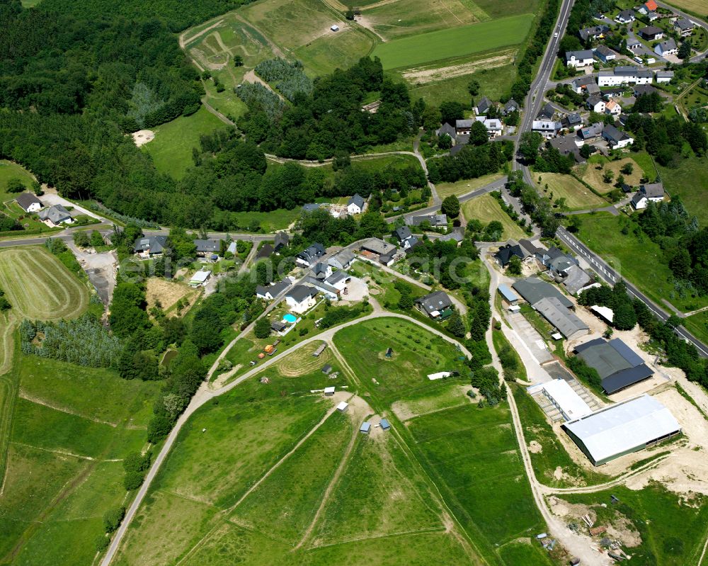 Ehr from the bird's eye view: Agricultural land and field boundaries surround the settlement area of the village in Ehr in the state Rhineland-Palatinate, Germany