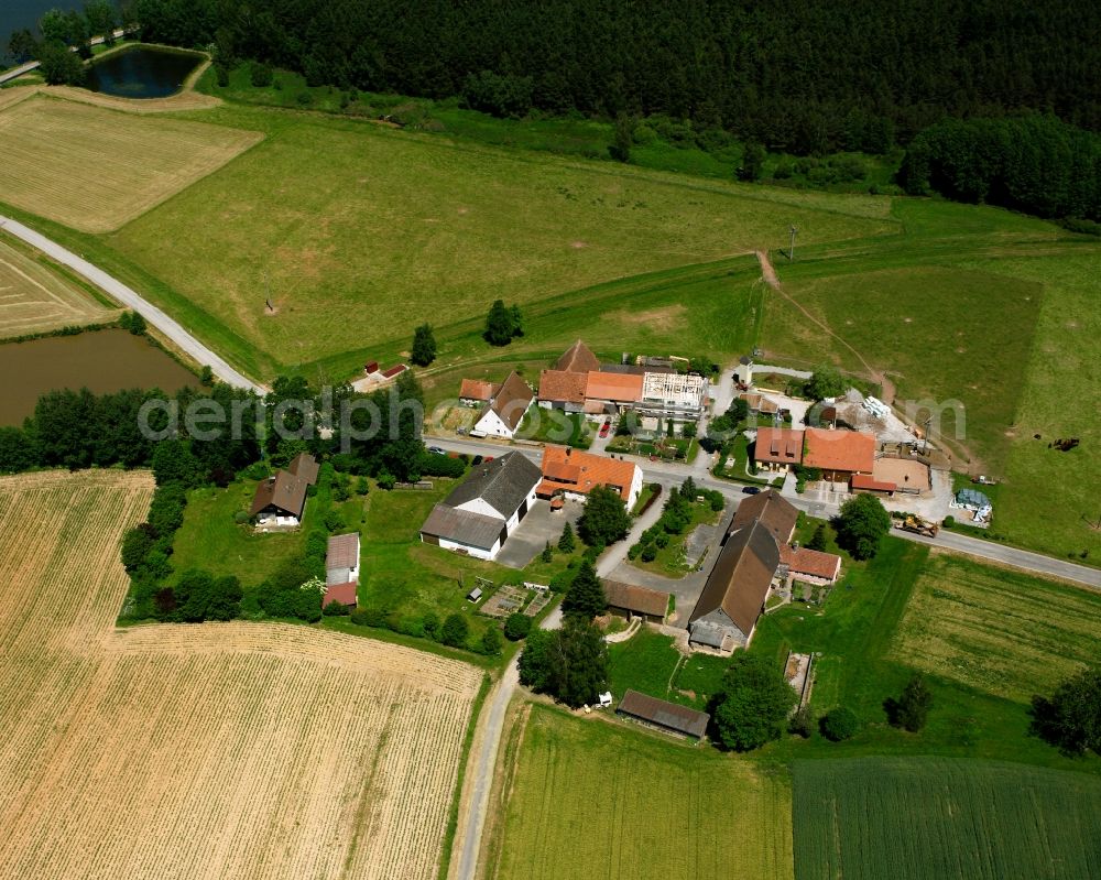 Ehrenschwinden from above - Agricultural land and field boundaries surround the settlement area of the village in Ehrenschwinden in the state Bavaria, Germany