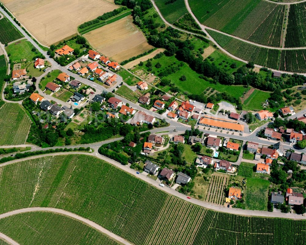 Aerial photograph Eichelberg - Agricultural land and field boundaries surround the settlement area of the village in Eichelberg in the state Baden-Wuerttemberg, Germany