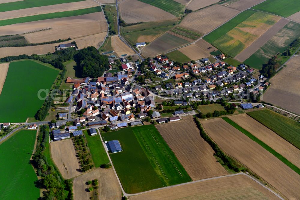 Eichelsee from the bird's eye view: Agricultural land and field boundaries surround the settlement area of the village in Eichelsee in the state Bavaria, Germany