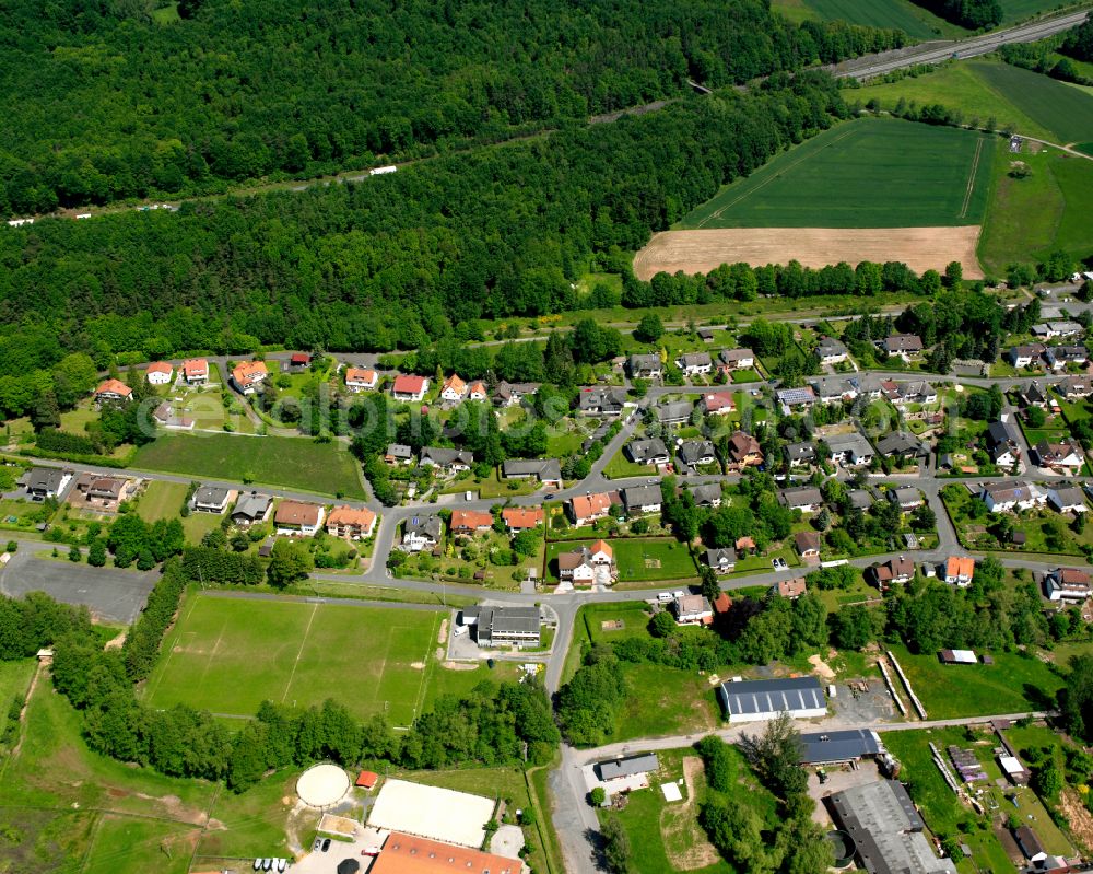 Eifa from the bird's eye view: Agricultural land and field boundaries surround the settlement area of the village in Eifa in the state Hesse, Germany