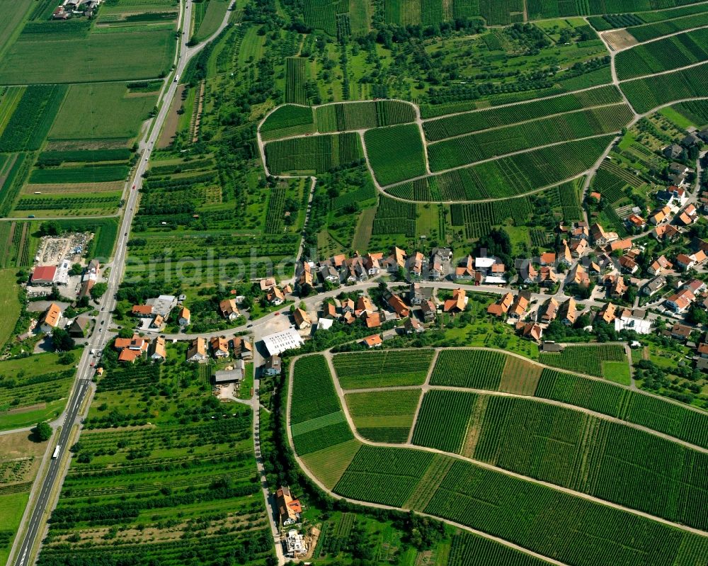 Eisental from above - Agricultural land and field boundaries surround the settlement area of the village in Eisental in the state Baden-Wuerttemberg, Germany